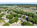 Expansive aerial view of the neighborhood showcasing the homes, trees, and picturesque lakes in the area at 1324 Saddleridge Dr, Orlando, FL 32835
