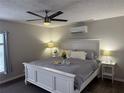 Comfortable bedroom with ceiling fan, stylish decor and wooden floors at 14400 Saint Georges Hill Dr, Orlando, FL 32828