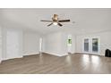 Bright and airy living room with new laminate flooring and french doors at 1491 Granada Ave, Daytona Beach, FL 32117