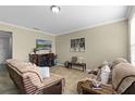 Cozy living room featuring comfortable seating and a decorative fireplace at 1553 Caterpillar St, St Cloud, FL 34771