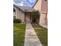 A charming single-Gathering home featuring a well-manicured lawn and inviting walkway at 1603 Emily Ct, Kissimmee, FL 34744