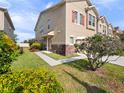A well-maintained home featuring verdant landscaping and inviting curb appeal on a sunny day at 1610 Mohegan Blvd, Kissimmee, FL 34744