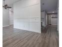 Bright living room with luxury vinyl plank flooring, custom trim, and neutral paint at 352 Inglenook Cir, Winter Springs, FL 32708