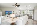 Spacious living room, dining area and kitchen offer an open living space at 38 Malauka Dr, Ocklawaha, FL 32179