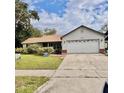 Charming single-Gathering home with attached two-car garage and well-maintained lawn at 4235 Shades Crest Ln, Sanford, FL 32773