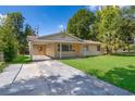 Charming single-story home with a well-maintained lawn and inviting front entrance at 4524 King Cole Blvd, Orlando, FL 32811