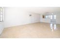 Bright and airy living room with terrazzo flooring, providing a clean and spacious ambiance at 4524 King Cole Blvd, Orlando, FL 32811