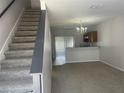 Open-concept living room featuring neutral paint, carpeted floors and natural light at 514 Wilton Cir, Sanford, FL 32773