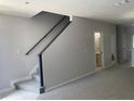 Staircase with neutral carpet and gray trim connecting the different levels of the home at 514 Wilton Cir, Sanford, FL 32773