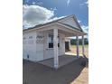 New construction shows covered patio with support columns and a view of the lot at 707 Junonia Blvd, New Smyrna Beach, FL 32168