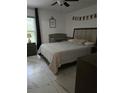 Bright bedroom featuring a queen bed, window, and matching furniture at 837 Pebble Creek Cir, Orlando, FL 32824