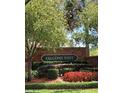 Stone community sign for Falcons Nest surrounded by manicured landscaping at 1240 Falconcrest Blvd, Apopka, FL 32712