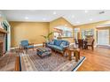 Inviting living room with hardwood floors, open to dining area and kitchen, perfect for entertaining at 134 Heron Bay Cir, Lake Mary, FL 32746