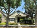 Charming single-Gathering home with mature trees, lush landscaping, and inviting curb appeal at 14479 Tanja King Blvd, Orlando, FL 32828