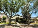 Inviting single-Gathering home featuring mature trees, lush landscaping, and lovely curb appeal at 14479 Tanja King Blvd, Orlando, FL 32828