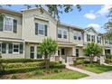 Street view of two story home featuring a covered porch and well-maintained landscaping at 15477 Blackbead St, Winter Garden, FL 34787