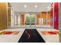 An inviting lobby with mosaic tile accents and the building name on the floor at 155 S Court Ave # 2406, Orlando, FL 32801