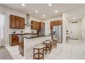 Modern kitchen with stainless steel appliances, a center island, and stylish countertops at 17084 Harbor Oak Pkwy, Winter Garden, FL 34787