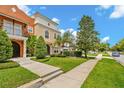 A well-maintained street scene showcasing the home's inviting curb appeal at 1745 Indiana Ave # J, Winter Park, FL 32789