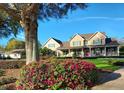 Charming two-story home with lush front garden and well-manicured lawn at 17631 Vista Belle Ct, Montverde, FL 34756
