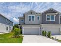 Attractive two-story townhouse featuring a one-car garage and a concrete driveway at 1915 Terrapin Rd, Ocoee, FL 34761