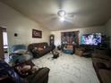 Inviting living room with ceiling fan and tile flooring at 2558 El Capitan Dr, Sanford, FL 32773