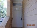 Inviting front door with an arched window on a house with vinyl siding at 3166 S Semoran Blvd # 1007, Orlando, FL 32822