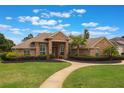 Inviting brick home with a well-maintained lawn and a curved walkway leading to the front entrance at 441 Hightower Dr, Debary, FL 32713