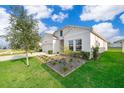 A well maintained house with a beautiful garden and great curb appeal at 6984 Dilly Lake Ave, Groveland, FL 34736