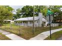 Corner lot featuring a single-story home with a fenced yard and a sidewalk at 715 Ballard St, Altamonte Springs, FL 32701
