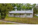 Charming single-story home featuring a fenced yard and a sidewalk at 715 Ballard St, Altamonte Springs, FL 32701