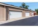 Attached garages with white doors and ample parking space on a smooth, paved driveway at 804 Challis Pt, Longwood, FL 32779