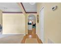 Inviting foyer with hardwood flooring, neutral walls, and an archway leading to the living spaces at 842 Amidon St, Deltona, FL 32725