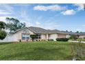 Charming single-story home featuring well-maintained lawn, lovely landscaping, and a welcoming facade at 842 Amidon St, Deltona, FL 32725