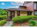 Charming condo showcasing a well-manicured lawn and beautiful earth-tone finishes at 1017 Love Ln # 34, Apopka, FL 32703