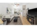 Spacious living room featuring high ceilings, a cozy fireplace, and an open floor plan at 1017 Love Ln # 34, Apopka, FL 32703