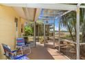 Enclosed patio featuring a seating area and offering a view of the surrounding landscape at 1190 Pecan St, Kissimmee, FL 34744
