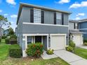 Charming two-story townhome with a one car garage and beautiful landscaping at 12661 Somerset Oaks St, Orlando, FL 32828