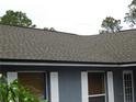 Close-up view showcasing the roofing and window details of the home's exterior at 130 Krider Rd, Sanford, FL 32773
