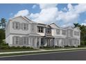 New construction townhomes feature a welcoming entry and charming architectural details, perfect for modern living at 1407 Mount Royal Dr, St Cloud, FL 34771
