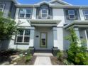 Charming townhome showcasing inviting front entrance and well-maintained landscaping at 1407 Mount Royal Dr, St Cloud, FL 34771