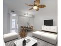 Nicely appointed living room with stylish furniture, ceiling fan, and dining area at 151 N Orlando Ave # 204, Winter Park, FL 32789