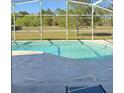 Relaxing screened-in pool area, great for outdoor fun with beautiful backyard views and ample space for lounging at 17517 Silver Creek Ct, Clermont, FL 34714