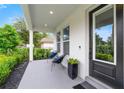 Inviting front porch with comfortable seating, perfect for enjoying the outdoors and neighborhood views at 2110 Hillcrest St, Orlando, FL 32803