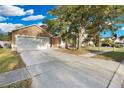 Charming single-Gathering home with a spacious driveway and mature trees at 2643 Alamosa Pl, Lake Mary, FL 32746