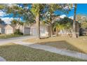 Charming single-Gathering home with a spacious driveway and mature trees at 2643 Alamosa Pl, Lake Mary, FL 32746
