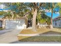 Charming single-Gathering home with a spacious driveway and mature trees at 2643 Alamosa Pl, Lake Mary, FL 32746