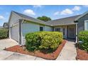 Charming home exterior featuring manicured landscaping and a welcoming entrance at 2681 Debany Rd, Kissimmee, FL 34744