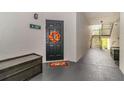 Condo entrance with a black door decorated with a festive fall wreath at 2717 Maitland Crossing # 207, Orlando, FL 32810