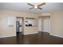 Spacious living room with a ceiling fan, stainless steel appliances, and granite countertops at 413 Summit Ridge Pl # 215, Longwood, FL 32779